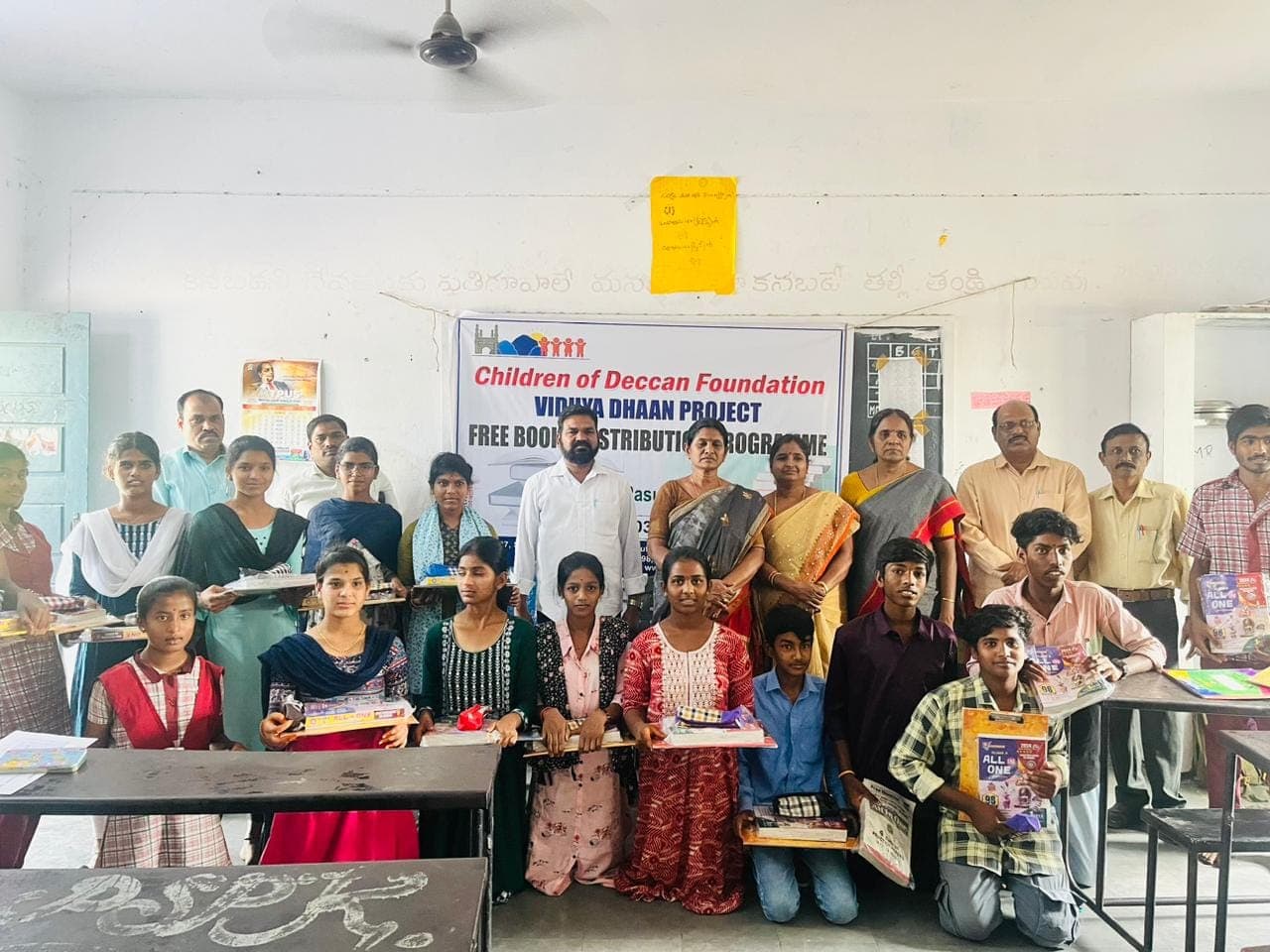 Students receiving free textbooks at a Vidya Dhaan distribution