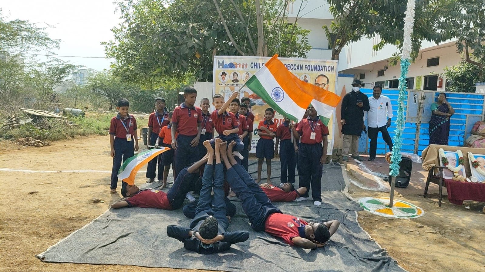 Boys building a human pyramid at a Republic Day celebration
